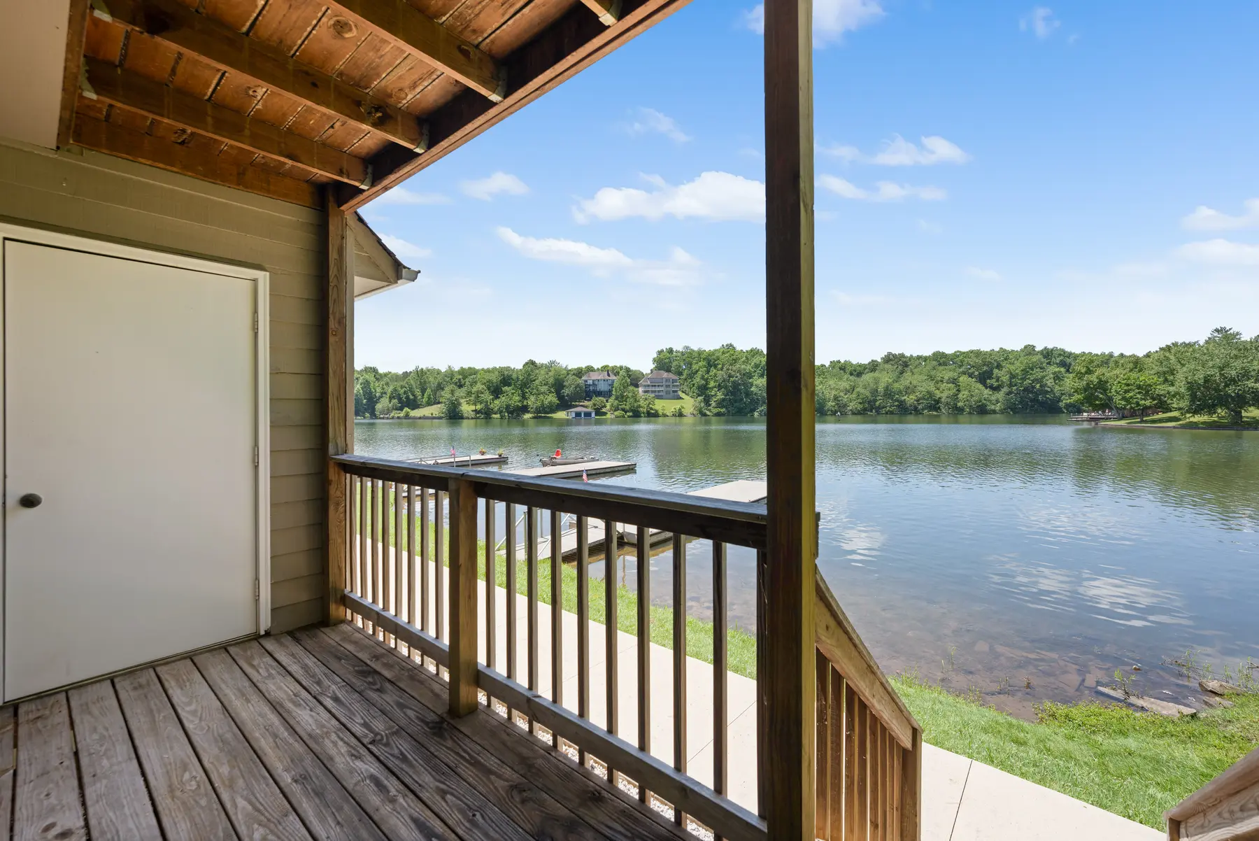 Private covered porch overlooking Lake Holiday at Unit 101