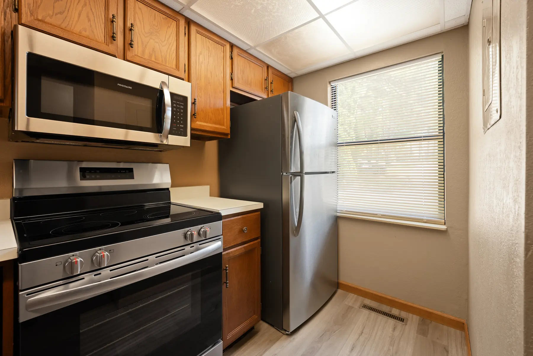 Updated kitchen with black appliances in Unit 101