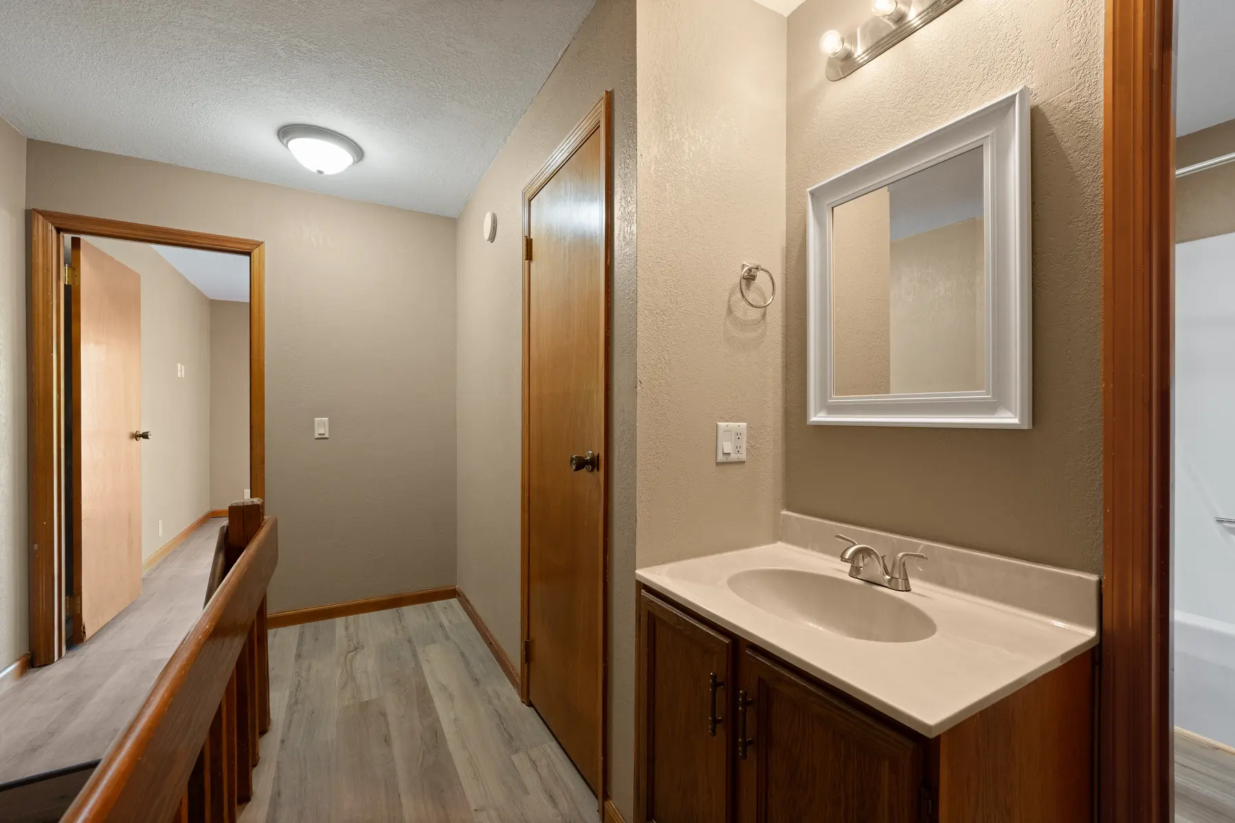 Upstairs hallway and bathroom vanity in Unit 101