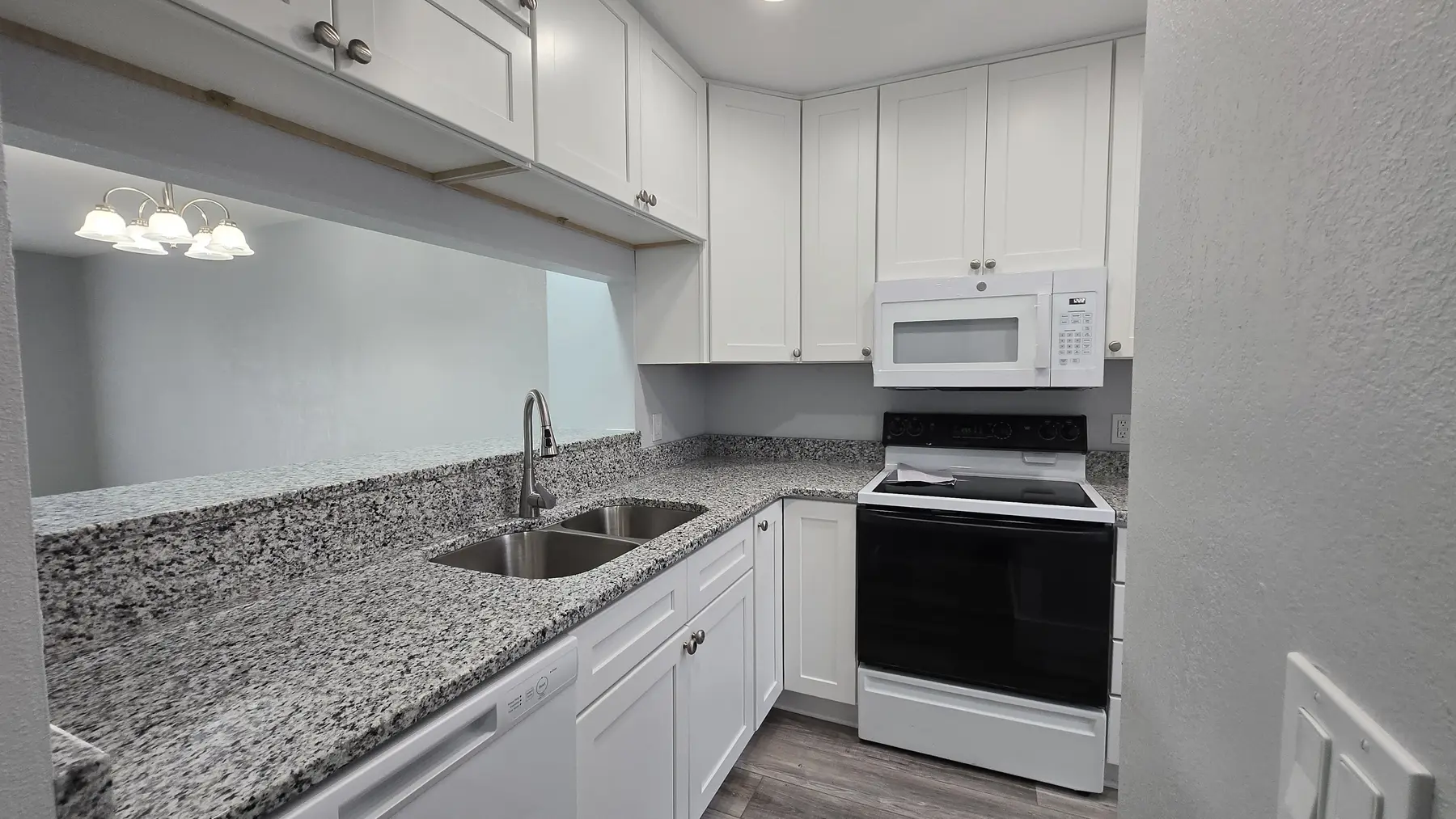Renovated open living and dining room in 176 Pointe Landing Unit 103