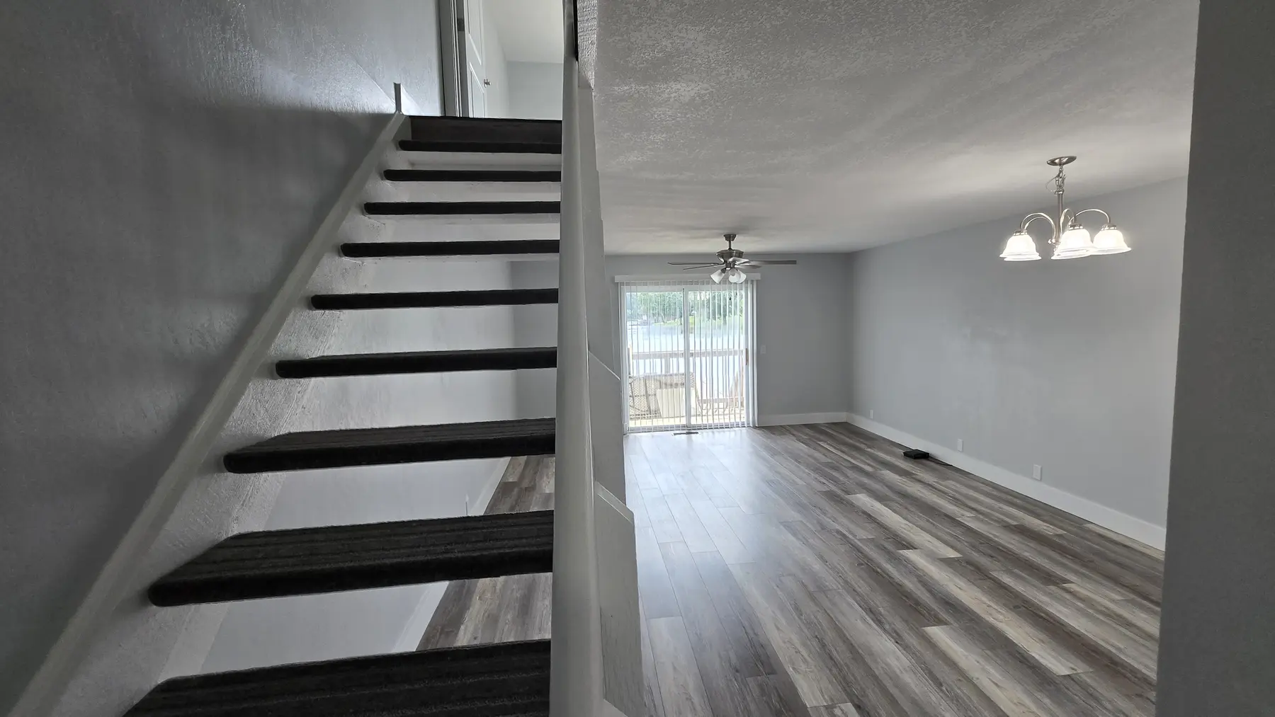 Updated staircase and dining area in Unit 103