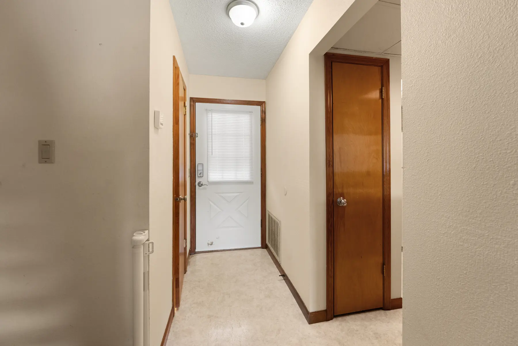 Entry hallway and coat closet in Unit 102