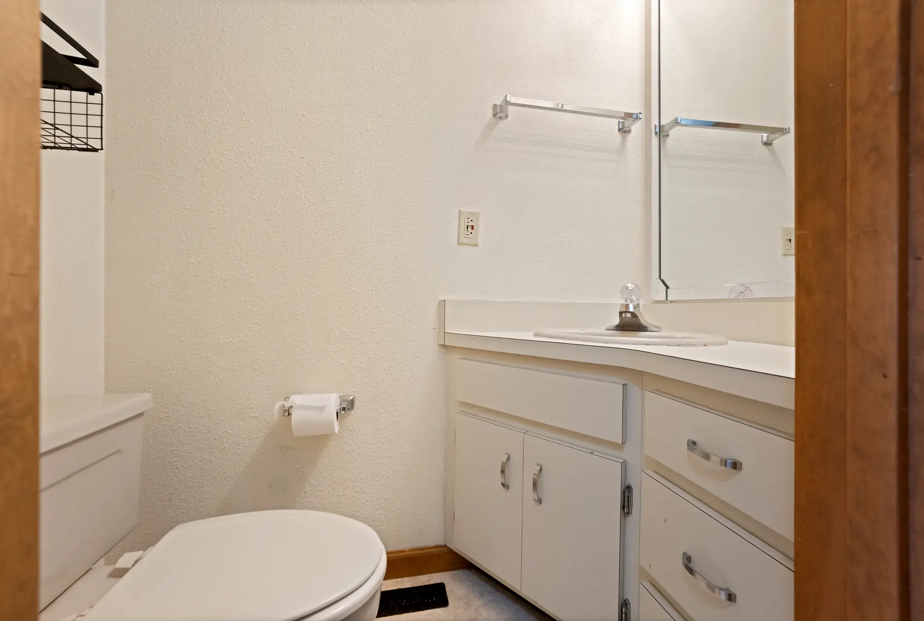 Main-level half bathroom in Unit 102