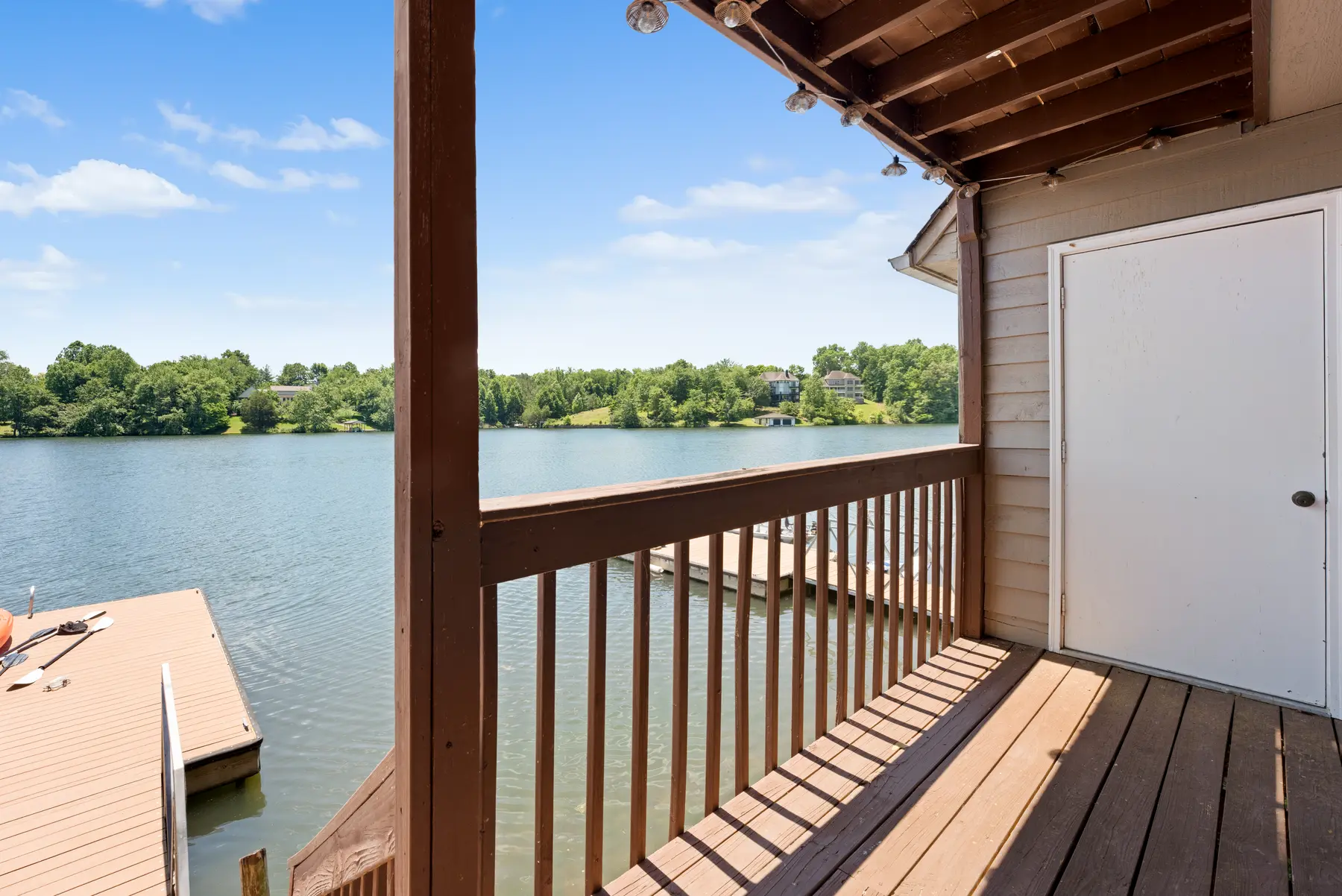 Private covered balcony overlooking Lake Holiday at Unit 102