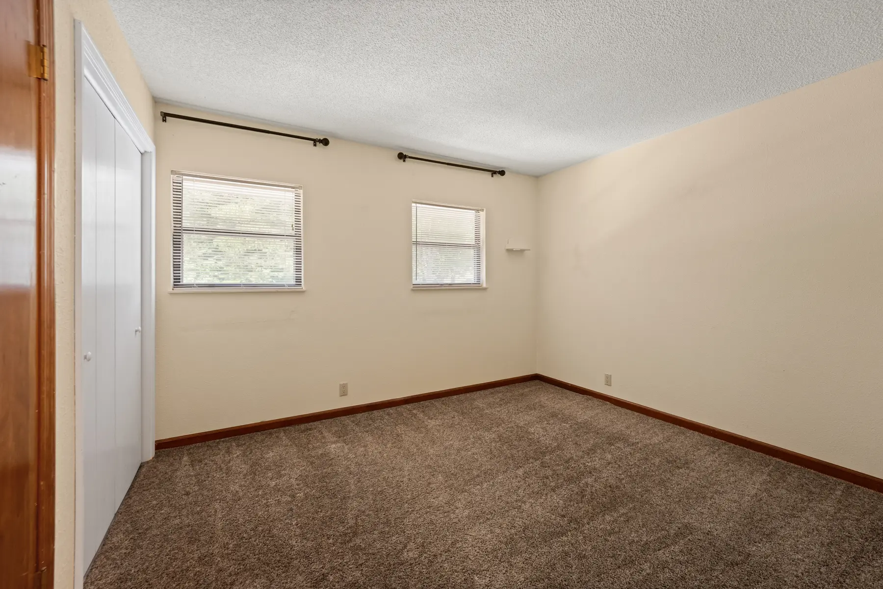 Second bedroom with two windows in Unit 102