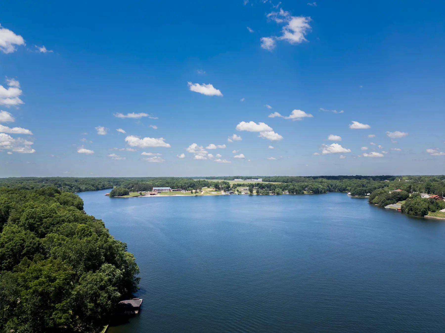 Wide aerial lake view above Pointe Landing