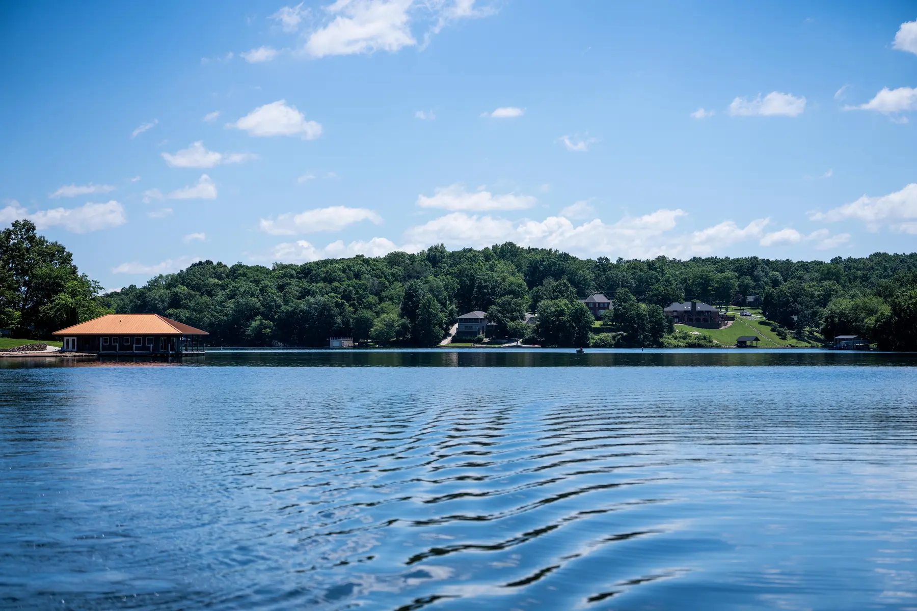 Calm water and wooded shoreline on Lake Holiday